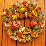 A fall wreath includes colors that can last into the new year.