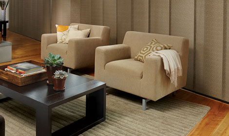 two beige square chairs with brown rectangular coffee table