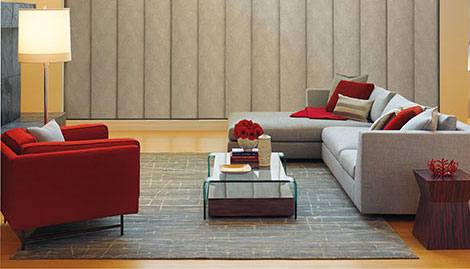 Bright red chair paired with gray couch