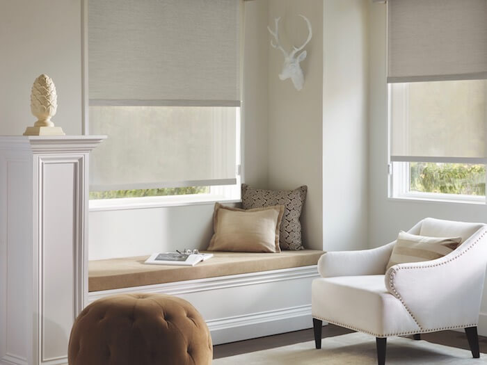 Beautifully finish your room with a casual spot to read or chat. Shown with Designer Screen Shades.